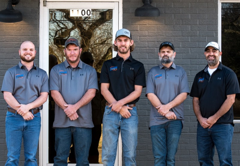 Photograph of the team at Moore's A/C & Heating Inc. 
